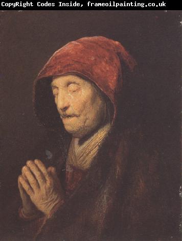 REMBRANDT Harmenszoon van Rijn An old woman at prayer (mk33)